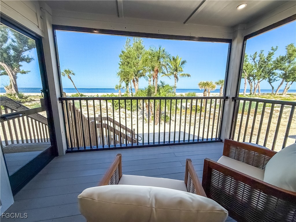 1411 Beach Cottages, Unit 1411 Captiva, FL 33924 - Photo 15 of 40 a view of a porch with wooden floor