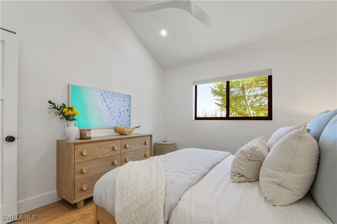 1411 Beach Cottages, Unit 1411 Captiva, FL 33924 - Photo 22 of 40 a bedroom with a bed and painting on the wall