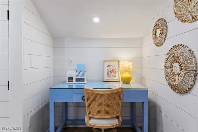 a dining room with a table and chairs