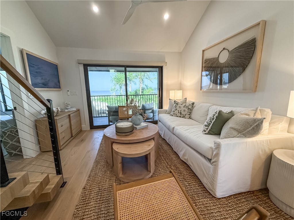 1411 Beach Cottages, Unit 1411 Captiva, FL 33924 - Photo 5 of 40 a living room with furniture and a large window