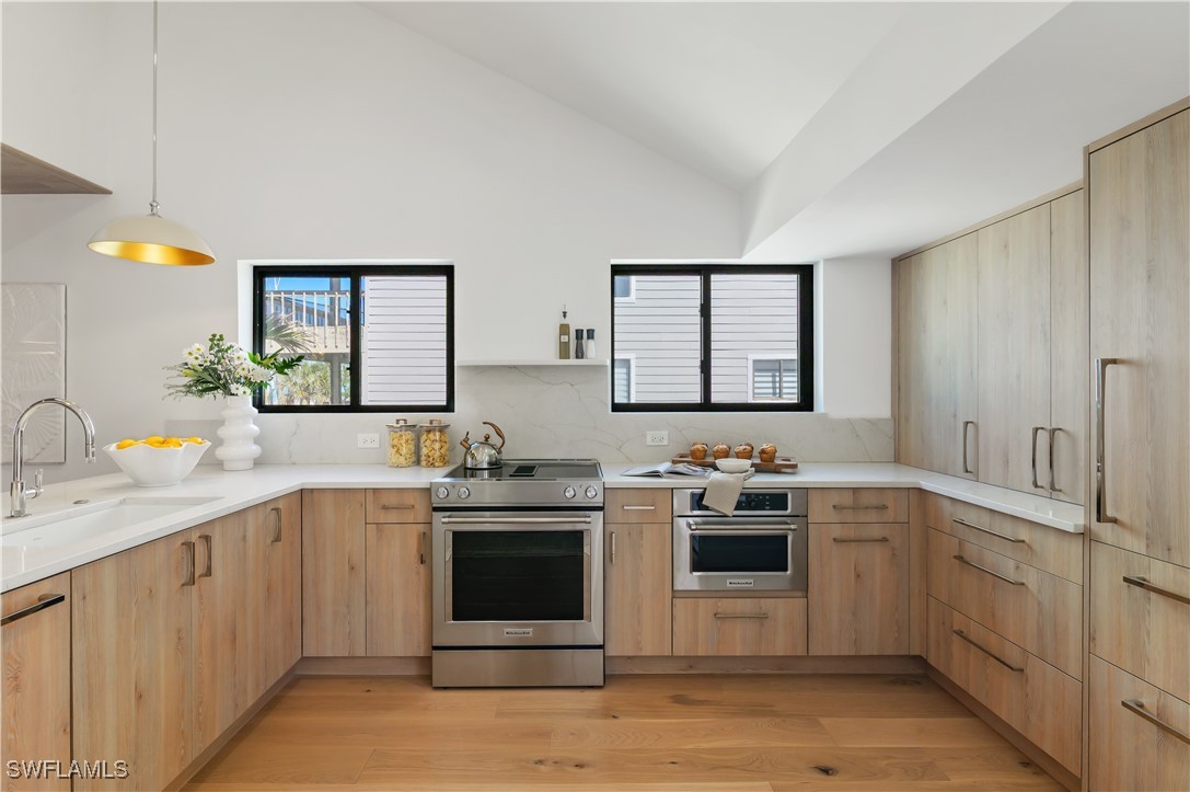 1411 Beach Cottages, Unit 1411 Captiva, FL 33924 - Photo 7 of 40 a kitchen with a sink and cabinets
