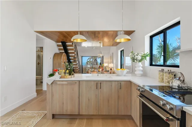 a kitchen with stainless steel appliances a sink and a stove