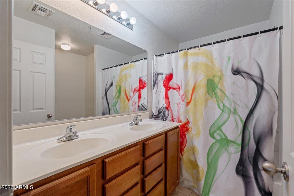 1255 South Rialto, Unit 106 Mesa, AZ 85209 - Photo 16 of 32 a bathroom with a sink and a mirror