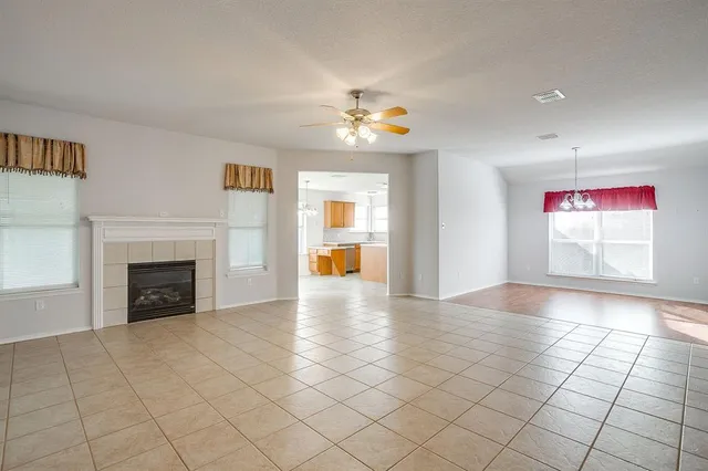 a kitchen with stainless steel appliances granite countertop wooden cabinets a sink and a stove