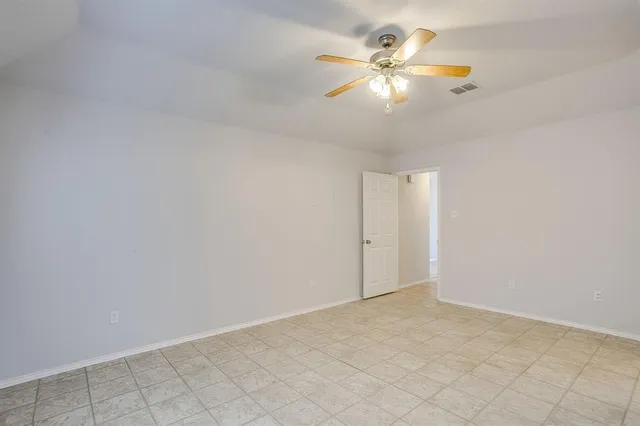 a bathroom with a sink a toilet and shower curtain