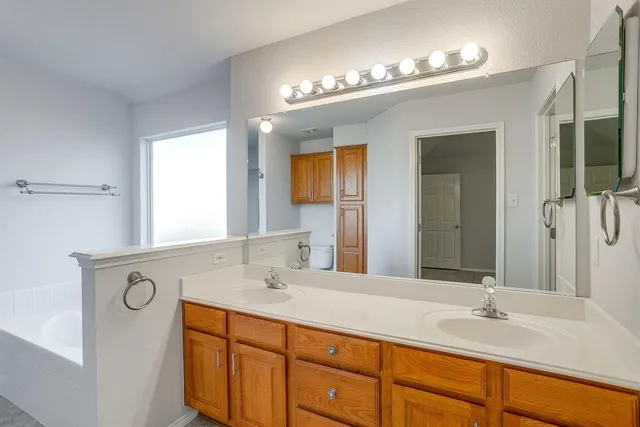 a view of storage and utility room with cabinets