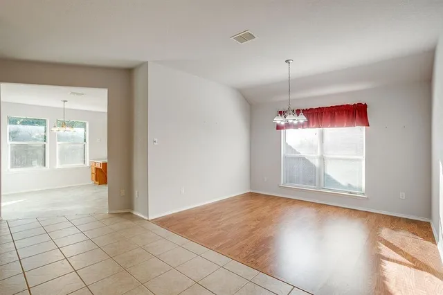a view of an empty room with a fireplace