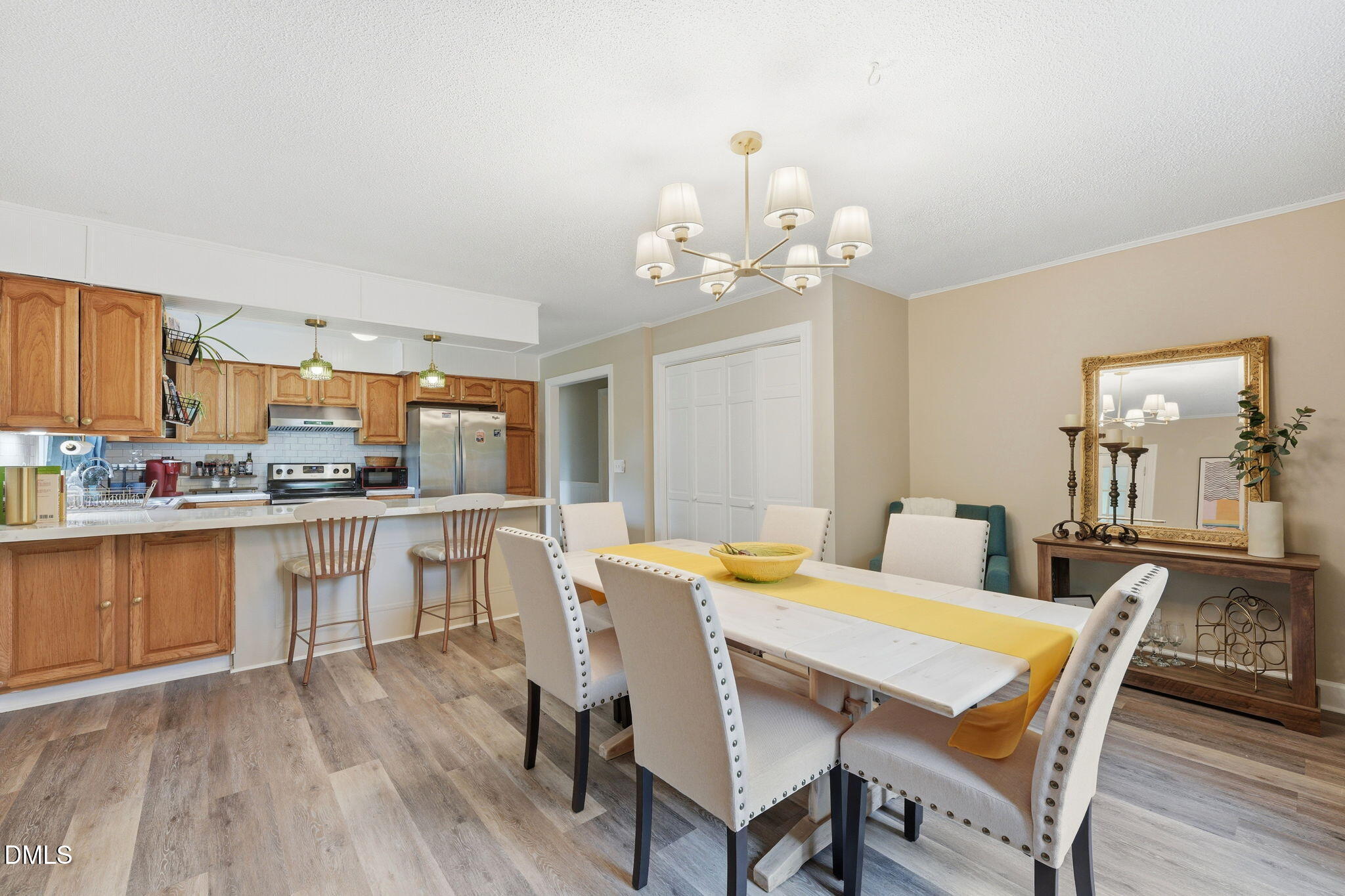 3200 Mill Creek Road Efland, NC 27243 - Photo 29 of 44 a view of a dining room with furniture and wooden floor