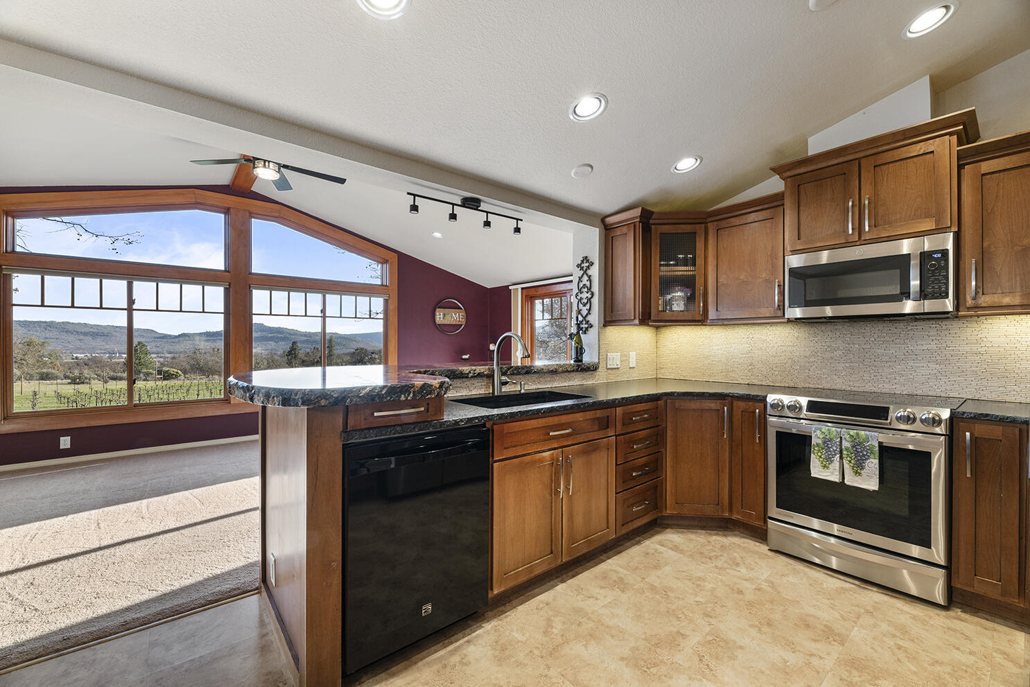 1052 Holcomb Springs Road Gold Hill, OR 97525 - Photo 37 of 65 Kitchen with Center Island and Vineyard Views