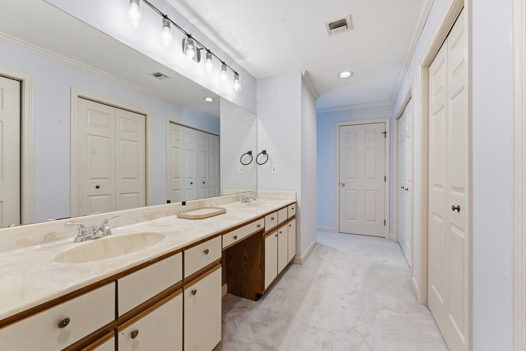 36 Shady Brook, Unit 36 West Springfield, MA 01089 - Photo 11 of 19 a bathroom with a sink double vanity and a mirror