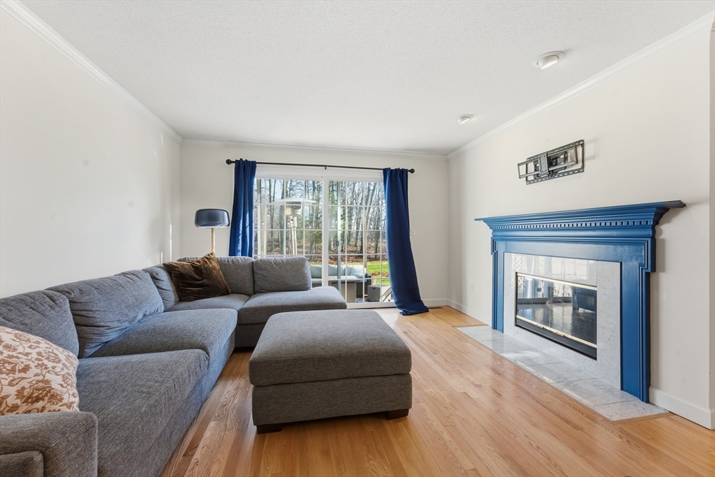 36 Shady Brook, Unit 36 West Springfield, MA 01089 - Photo 3 of 19 a living room with a couch and a fireplace
