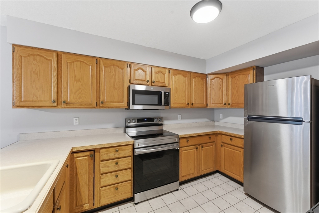 36 Shady Brook, Unit 36 West Springfield, MA 01089 - Photo 8 of 19 a kitchen with a refrigerator sink and microwave