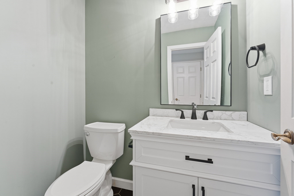 36 Shady Brook, Unit 36 West Springfield, MA 01089 - Photo 10 of 19 a bathroom with a granite countertop toilet sink and mirror