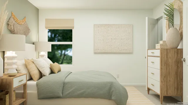 a bedroom with a bed and a window