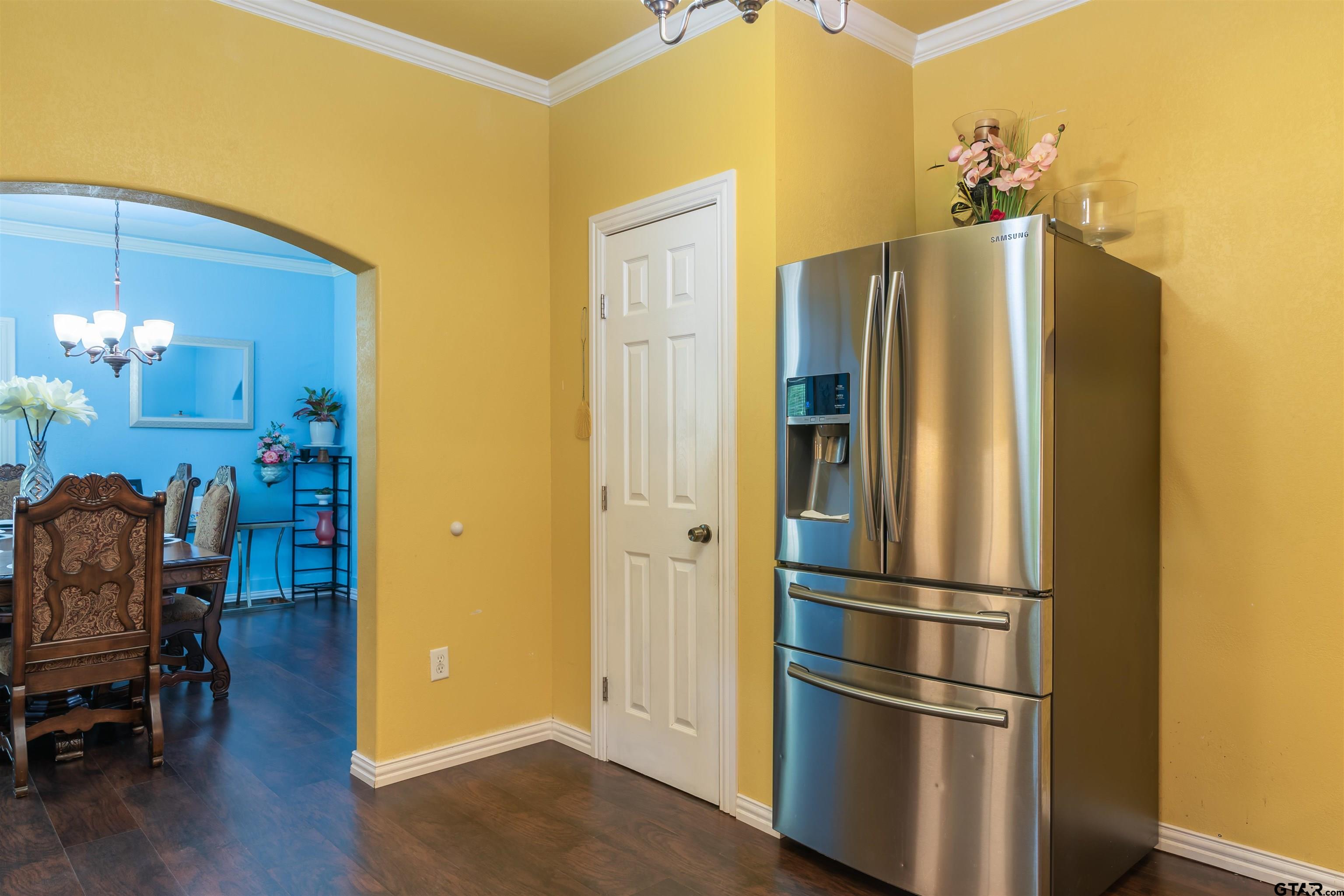 427 East Locust Street Tyler, TX 75702 - Photo 14 of 42 a metallic refrigerator freezer sitting in a kitchen