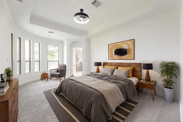 a view of a room with a ceiling fan and window