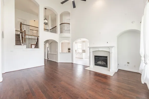 a view of a dining room with furniture a chandelier and wooden floor