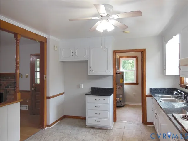 a kitchen with a stove a sink and a refrigerator