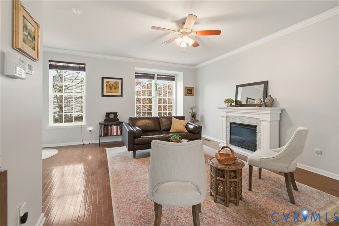 4836 Skyline Ridge Drive Midlothian, VA 23112 - Photo 14 of 44 a living room with furniture a fireplace and a window