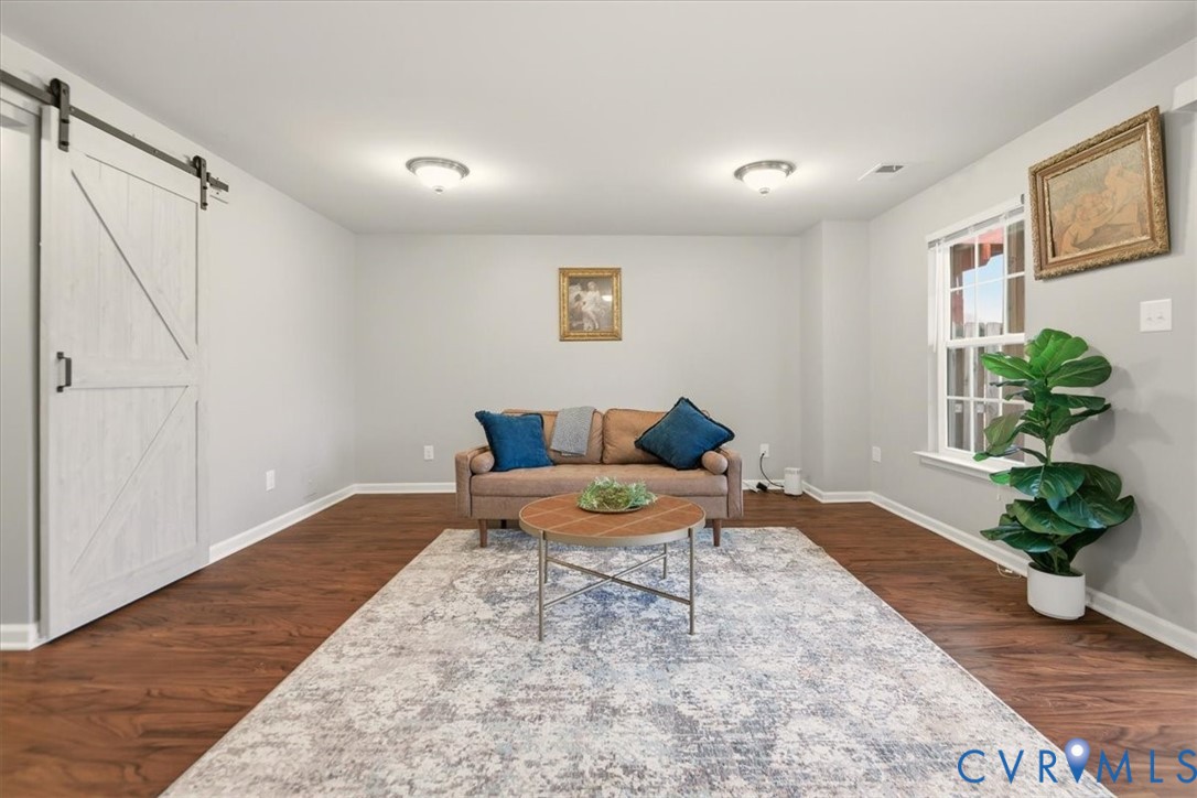 4836 Skyline Ridge Drive Midlothian, VA 23112 - Photo 25 of 44 a bedroom with a bed and a potted plant