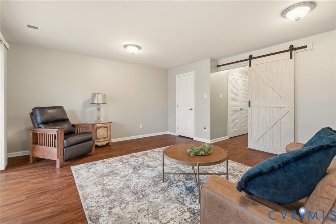 4836 Skyline Ridge Drive Midlothian, VA 23112 - Photo 26 of 44 a living room with furniture and wooden floor