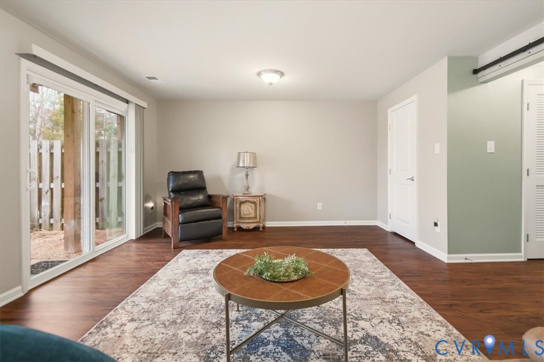 4836 Skyline Ridge Drive Midlothian, VA 23112 - Photo 27 of 44 a living room with furniture and a wooden floor