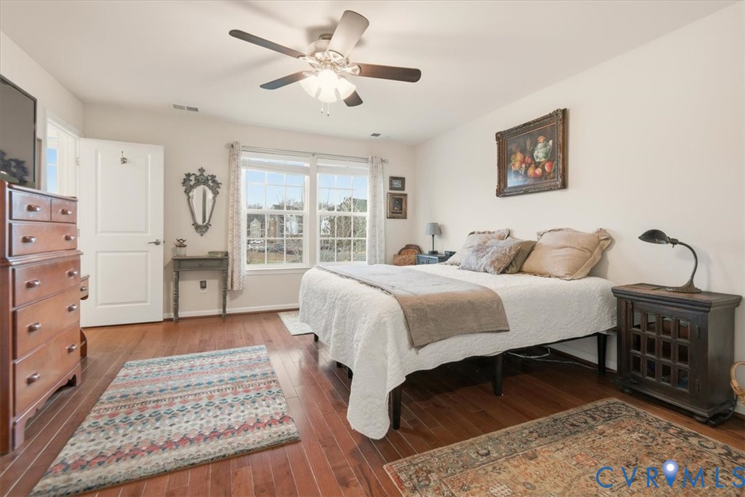 4836 Skyline Ridge Drive Midlothian, VA 23112 - Photo 36 of 44 a bedroom with a bed dresser and a window
