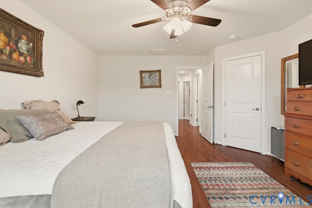 4836 Skyline Ridge Drive Midlothian, VA 23112 - Photo 38 of 44 a bedroom with a bed and a chandelier