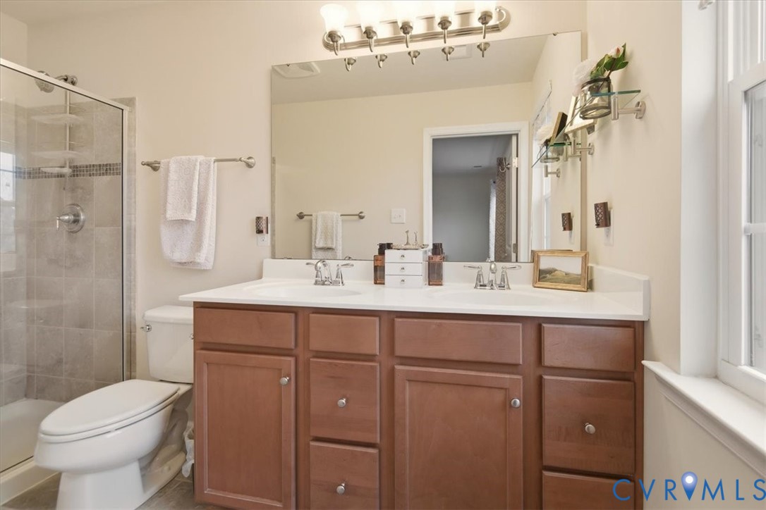 4836 Skyline Ridge Drive Midlothian, VA 23112 - Photo 39 of 44 a bathroom with a sink toilet and shower