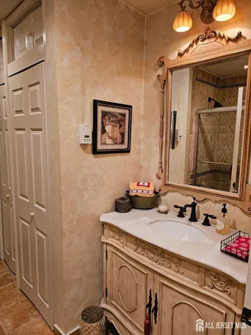 a bathroom with a sink and a mirror