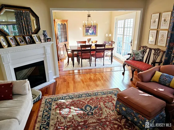 a living room with furniture fireplace and a bookshelf
