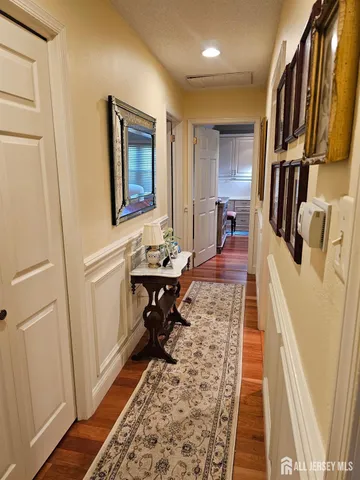 a living room with fish tank and a rug