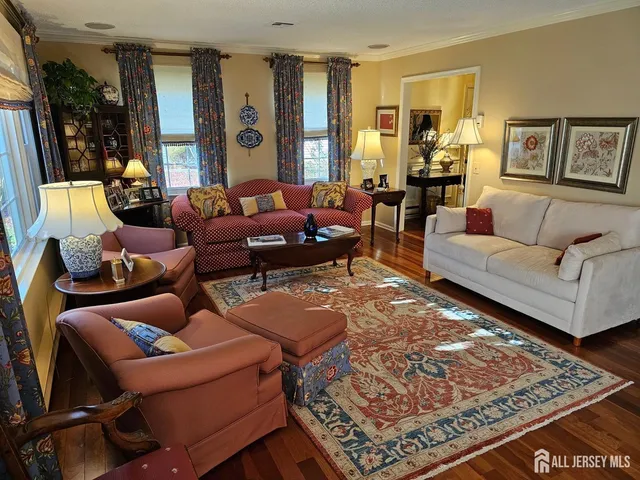 a living room with furniture and a rug