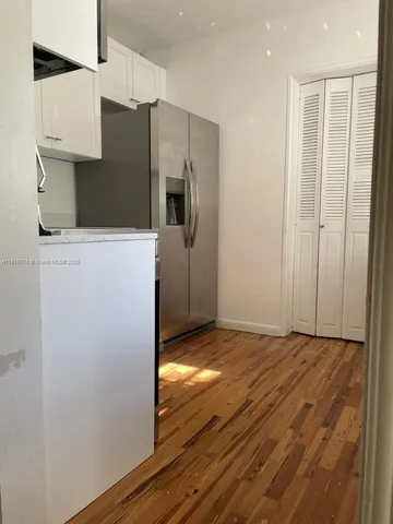 a view of workspace with wooden floor