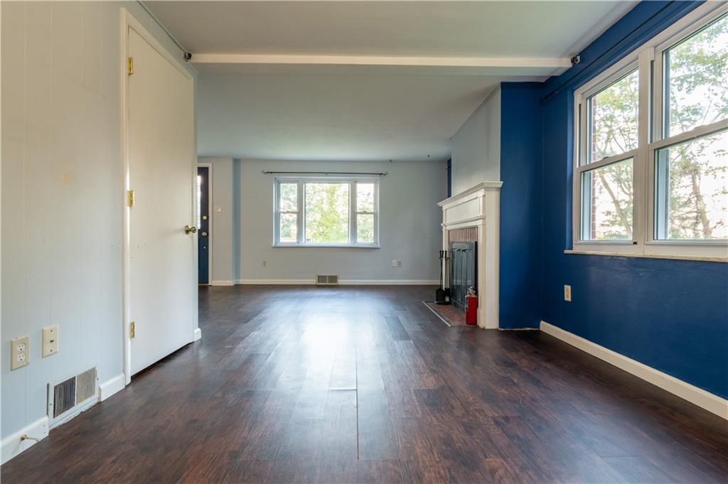 265 Chubbic Road Canonsburg, PA 15317 - Photo 7 of 22 an empty room with wooden floor and windows