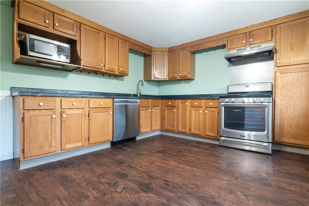 265 Chubbic Road Canonsburg, PA 15317 - Photo 10 of 22 a kitchen with stainless steel appliances granite countertop a refrigerator a stove and a microwave with cabinets