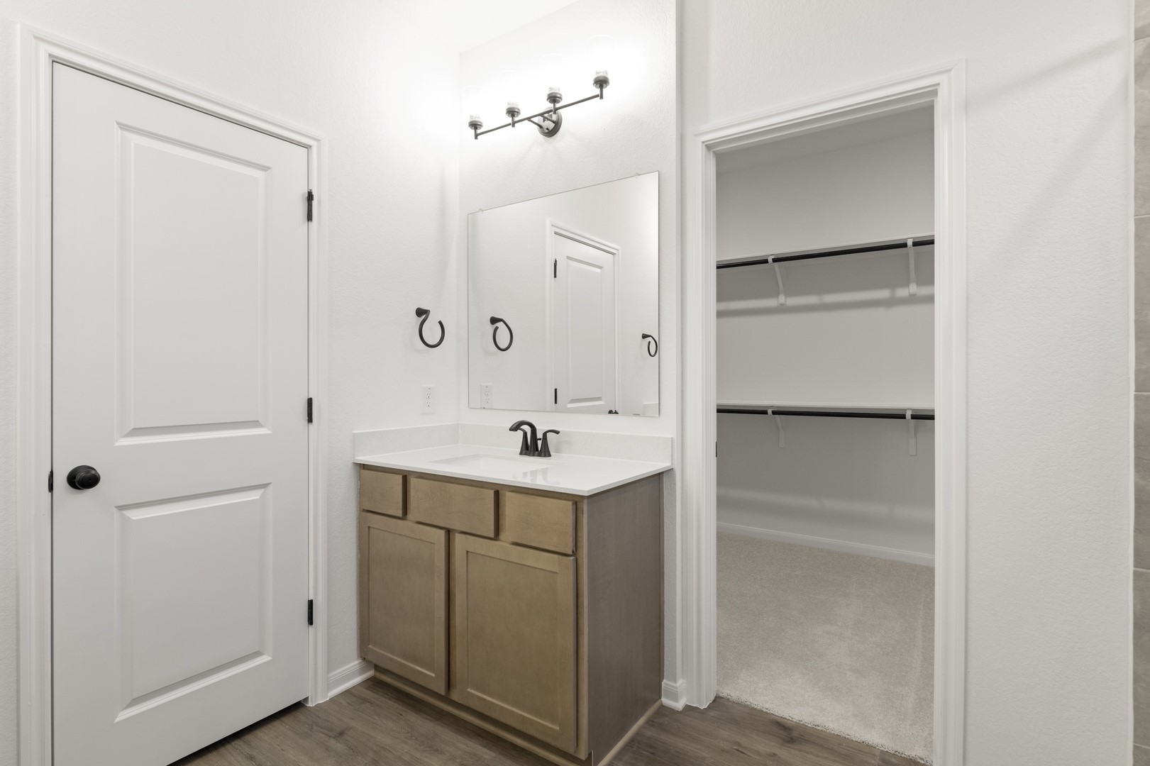 3717 Pin Oak Hills Seguin, TX 78155 - Photo 12 of 22 a bathroom with a sink vanity and a mirror
