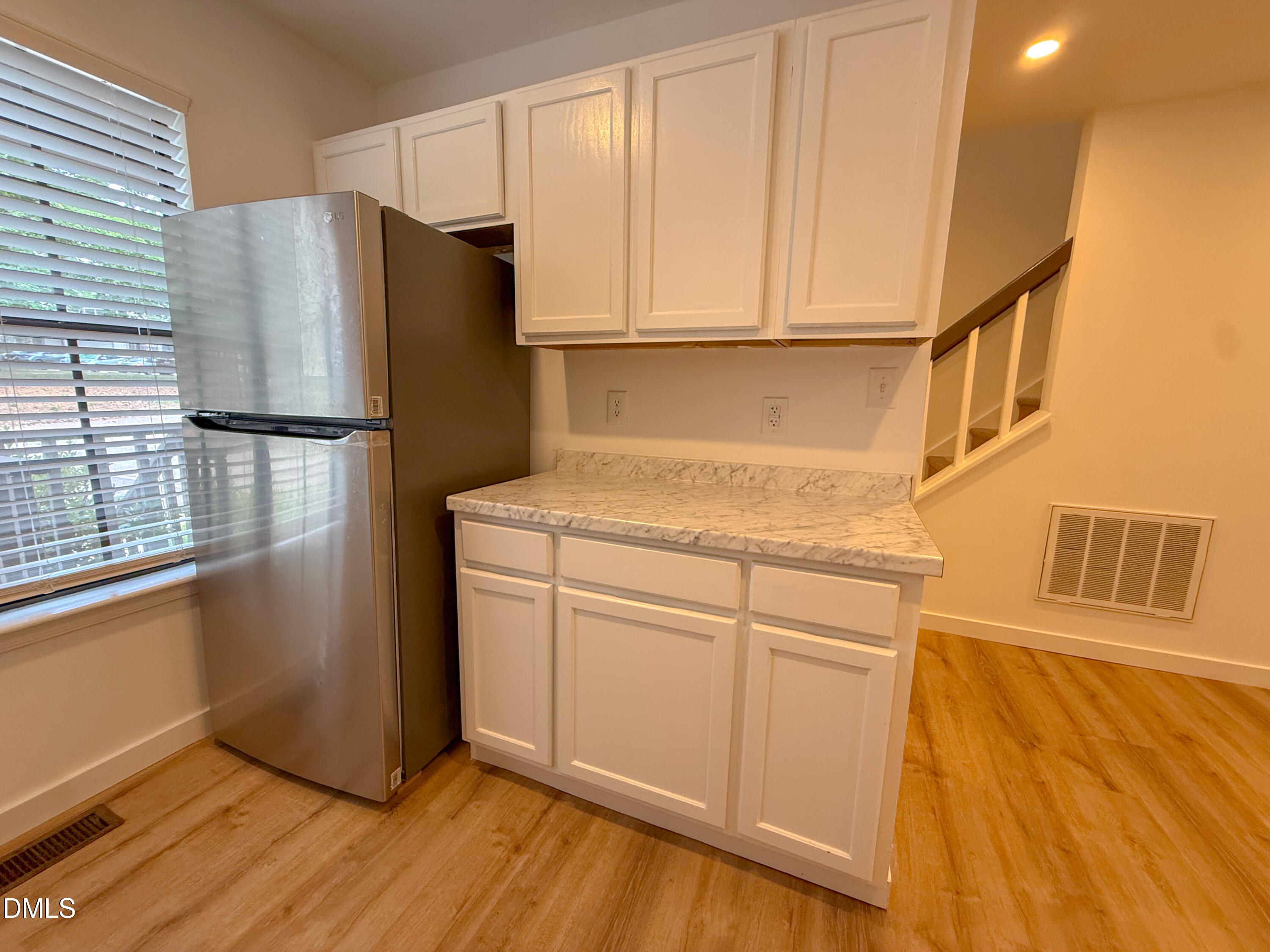 4247 The Oaks Drive Raleigh, NC 27606 - Photo 9 of 21 a white refrigerator freezer sitting inside of a kitchen