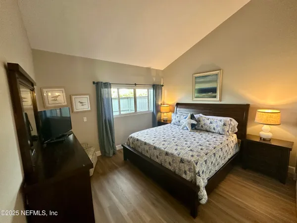 a view of a house with yard and sitting area