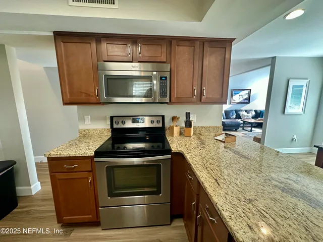 a bedroom with a bed and a mirror