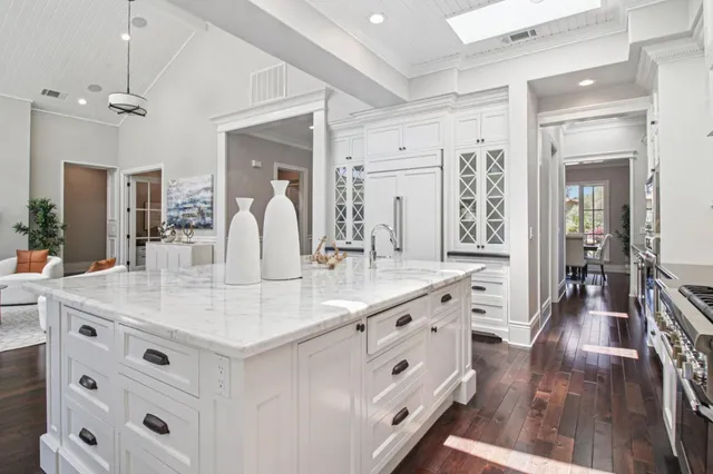 a living room with furniture and a clock