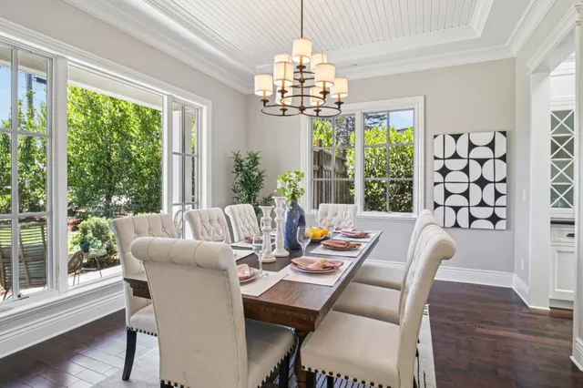 a living room with furniture or couches and a table with wooden floor