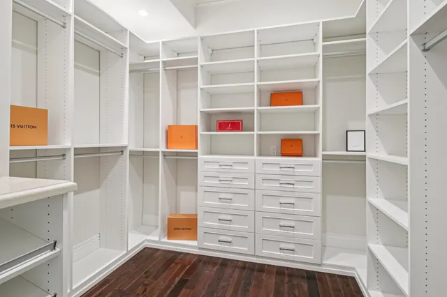a view of a workspace with furniture and wooden floor