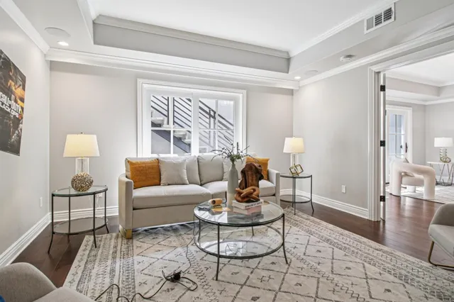 a spacious bedroom with a bed and a potted plant