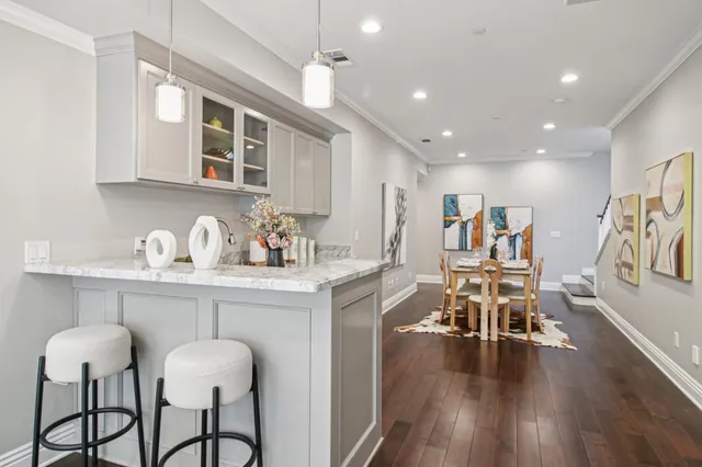 a view of backyard of house with seating area and green space