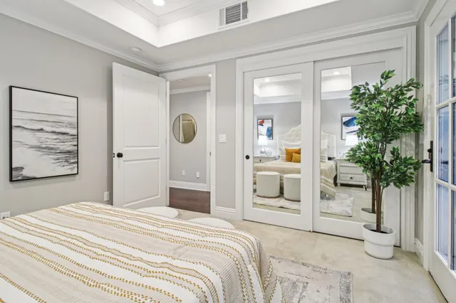 a front view of a house with a yard and trees