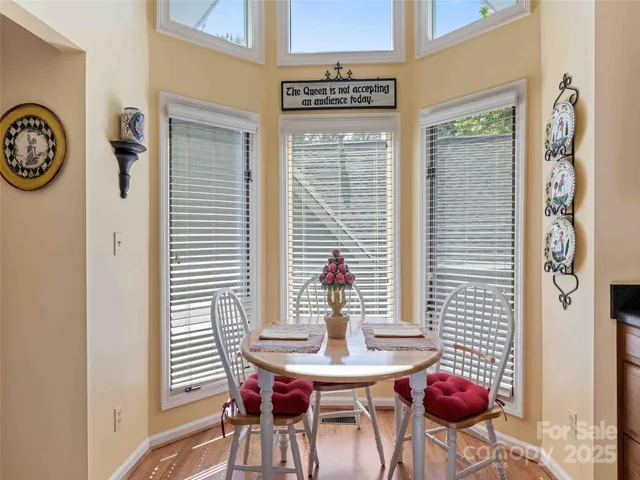 a view of a room that has a table and a chair