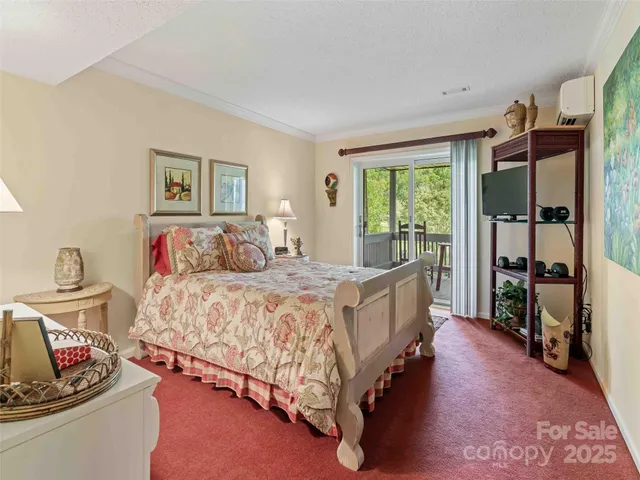 a spacious bedroom with a bed and a window