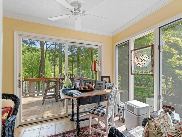 a dining room with furniture a chandelier and pool table