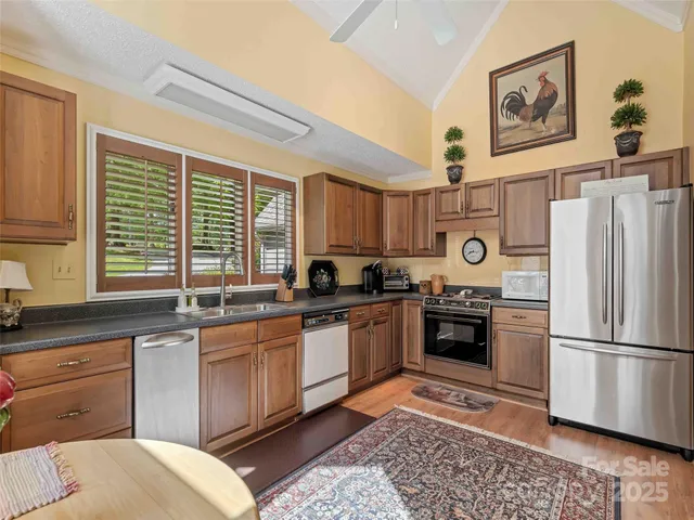 a kitchen with a refrigerator stove and sink
